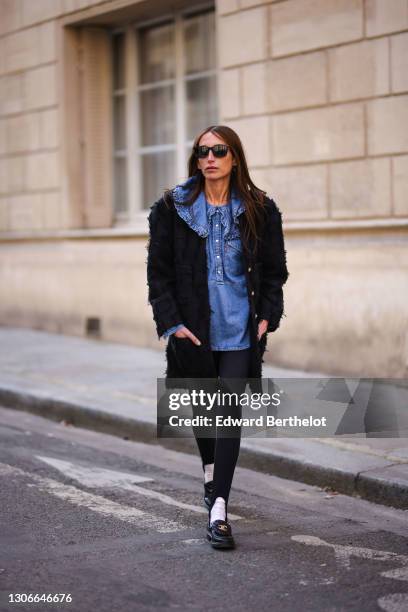 Chloe Harrouche @louloudesaison wears sunglasses, a black patchwork tweed jacket from Chanel, a blue ruffle denim shirt with oversize collar from...