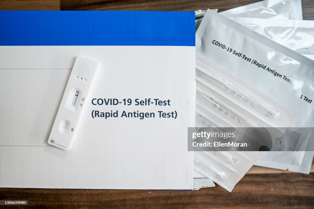 A close up of a lateral flow home testing kit