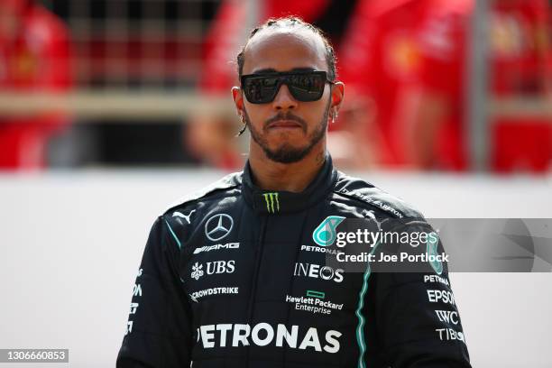 Lewis Hamilton of Great Britain and Mercedes GP looks on from the grid during Day One of F1 Testing at Bahrain International Circuit on March 12,...