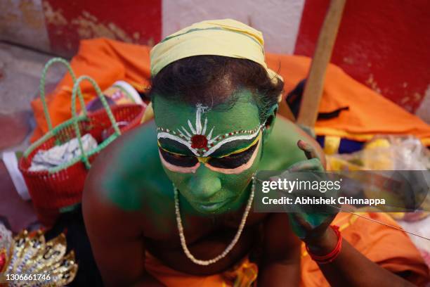 Man gets his face painted to the likeness of a Hindu god before Maha Shivratri revelries on March 12, 2021 in Kaveripattinam, India. Maha Shivaratri...