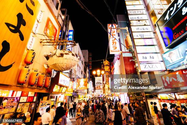 nightlife in dotonbori district, osaka, japan - osaka city stock pictures, royalty-free photos & images