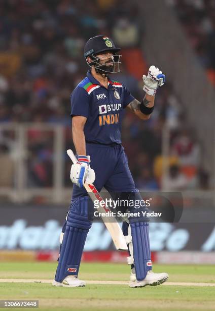 Virat Kohli of India walks off after being dismissed for 0 by Adil Rashid of England during the 1st T20 International match between India and England...