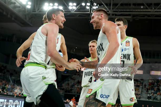 Mitchell Creek of the Phoenix and Cameron Gliddon of the Phoenix react during the NBL Cup match between the Cairns Taipans and the South East...