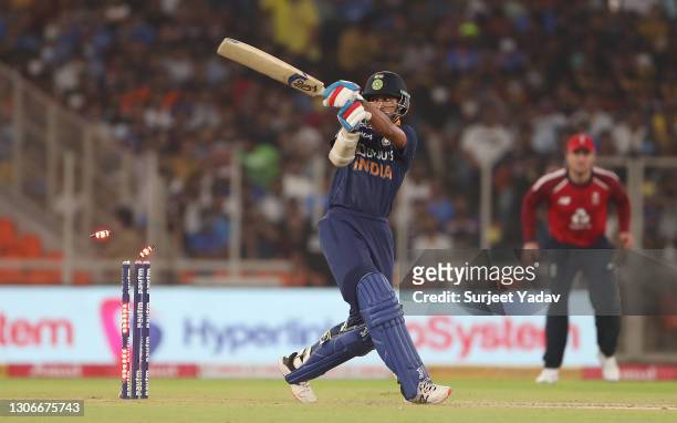 Shikhar Dhawan of India is bowled by Mark Wood of England for 4 during the 1st T20 International match between India and England at Sardar Patel...