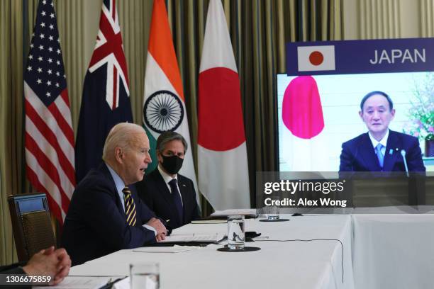 President Joe Biden, U.S. Secretary of State Anthony Blinken and Japanese Prime Minister Yoshihide Suga participate in a virtual meeting with leaders...