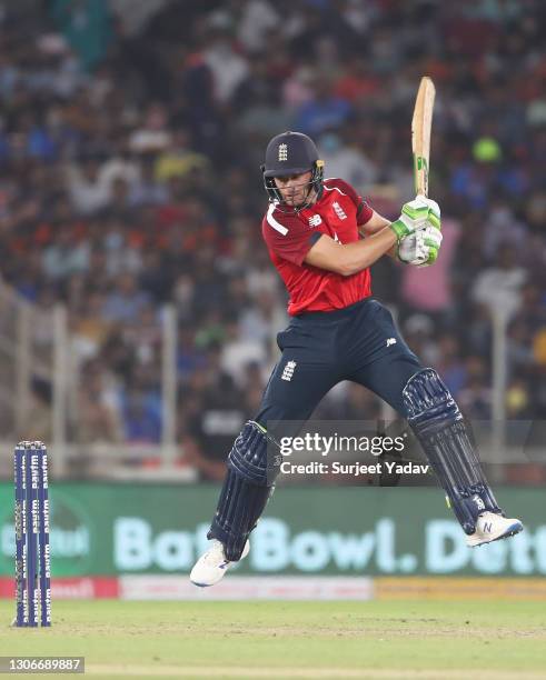 Jos Buttler of England cuts the ball during the 1st T20 International match between India and England at Sardar Patel Stadium on March 12, 2021 in...