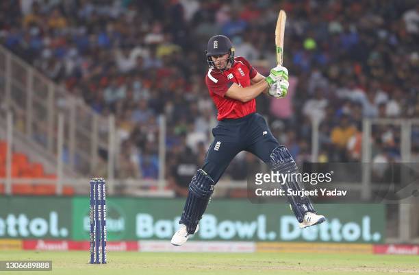 Jos Buttler of England cuts the ball during the 1st T20 International match between India and England at Sardar Patel Stadium on March 12, 2021 in...