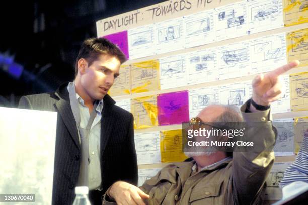 American actor Tom Cruise and director Brian De Palma on the set of the film 'Mission: Impossible', 1996. Behind them are various storyboard...