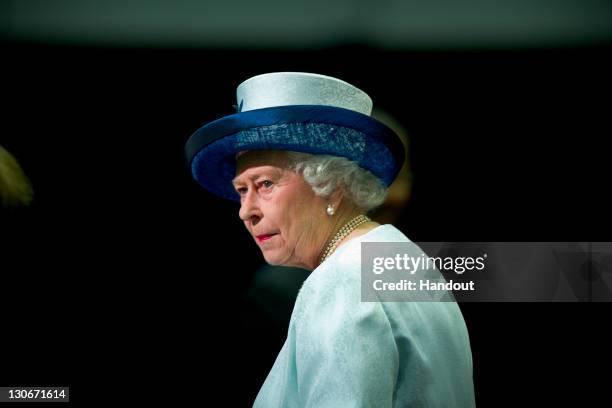 In this handout image provided by CHOGM, Queen Elizabeth II attends the offical photography session for CHOGM 2011, on October 28, 2011 in Perth,...