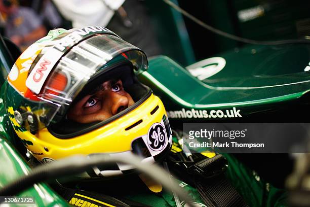 Karun Chandhok of India and Team Lotus prepares to drive during practice for the Indian Formula One Grand Prix at the Buddh International Circuit on...