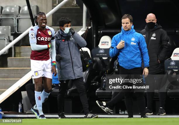 Bertrand Traore of Aston Villa is substituted off after falling over the advertising boards during the Premier League match between Newcastle United...