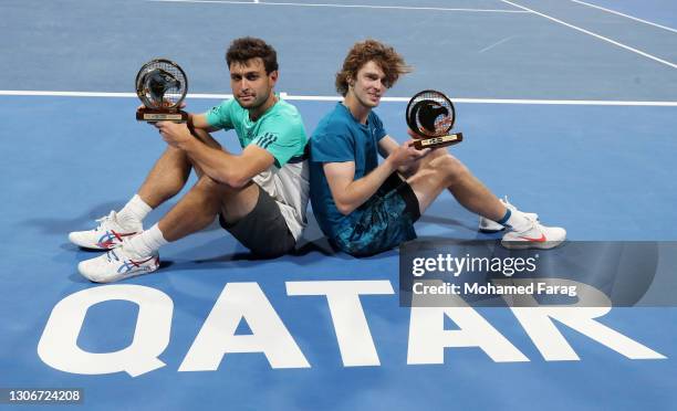Aslan Karatsev and Andrey Rublev of Russia pose with the trophy after victory in the Final of the Men's Doubles between Marcus Daniell & Philipp...