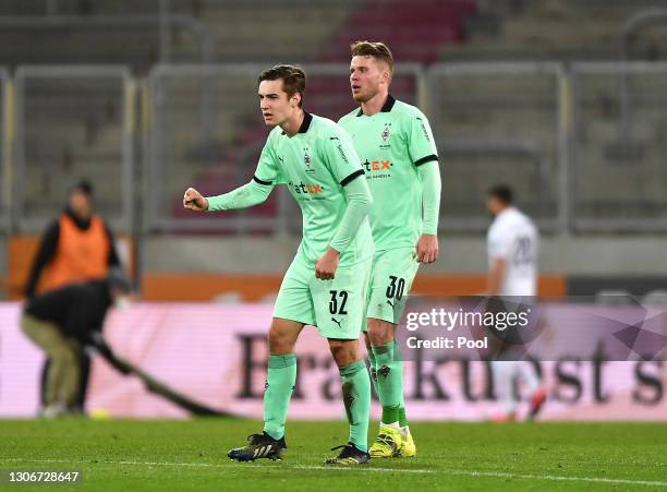 Florian Neuhaus of Borussia Moenchengladbach celebrates with teammate Nico Elvedi of Borussia Moenchengladbach after scoring their side's first goal...