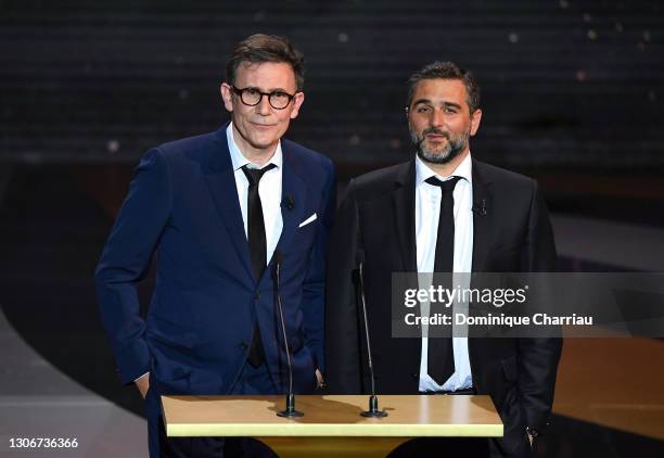 Michel Hazanavicius, Olivier Nakache on stage during the 46th Cesar Film Awards Ceremony At L'Olympia on March 12, 2021 in Paris, France.