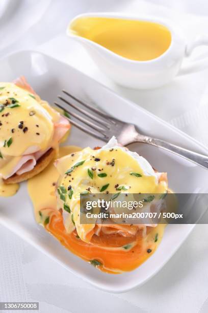 high angle view of food in plate on table - ベネディクティン ストックフォトと画像