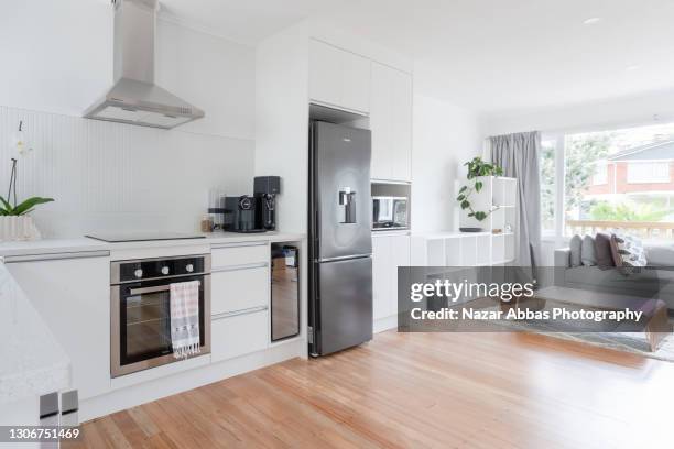 kitchen and living room open plan. - modern apartment stock pictures, royalty-free photos & images