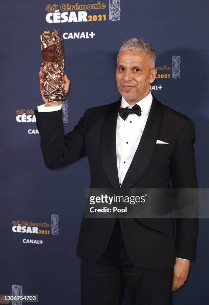 Sami Bouajila poses with the Best Actor Cesar award for the movie “Un Fils” during the 46th Cesar Film Awards Ceremony At L'Olympia on March 12, 2021...