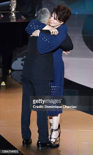 Sami Bouajila with Fanny Ardant after receiving the best actor Cesar Award for the movie “Un Fils” on stage during the 46th Cesar Film Awards...