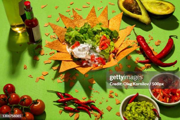 high angle view of various food on table - guacamole stock-fotos und bilder