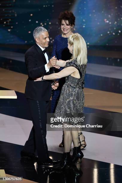 Sami Bouajila with Marina Fois and Fanny Ardant after receiving the best actor Cesar Award for the movie “Un Fils” on stage during the 46th Cesar...