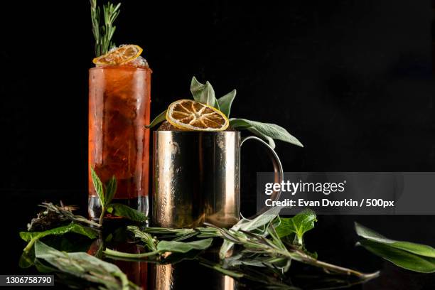 close-up of drink in glass on table against black background,baltimore,maryland,united states,usa - craft cocktail stock pictures, royalty-free photos & images