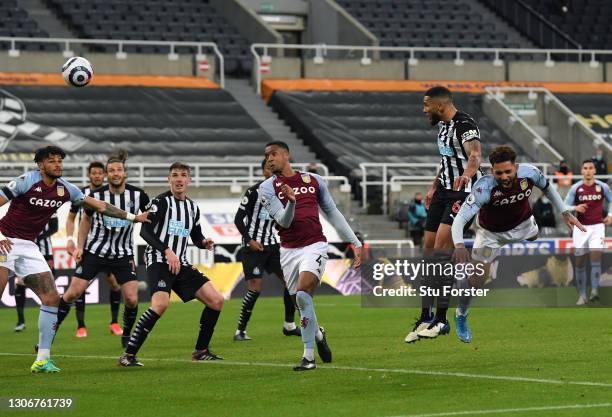 Newcastle captain Jamaal Lascelles rises above the Villa defence to head in the equalising goal during the Premier League match between Newcastle...