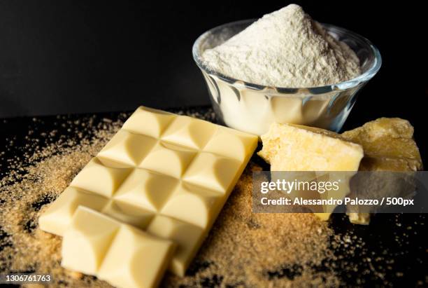 high angle view of cheese on table - chocolat blanc photos et images de collection