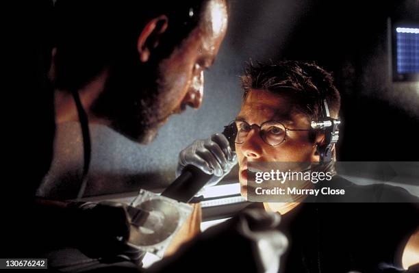 Actors Jean Reno as Franz Krieger and Tom Cruise as Ethan Hunt, in a scene from the film 'Mission: Impossible', 1996. Here they steal the NOC list...