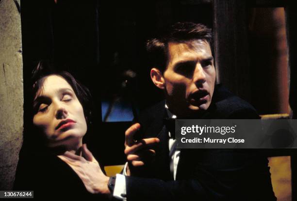 American actor Tom Cruise as Ethan Hunt, discovering the body of his murdered colleague, played by actress Kristin Scott Thomas, in a scene from the...