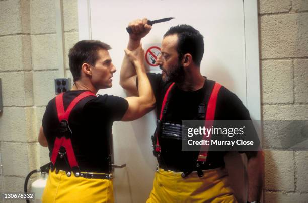 Actors Jean Reno as Franz Krieger and Tom Cruise as Ethan Hunt, in a scene from the film 'Mission: Impossible', 1996. Here Hunt prevents Krieger from...