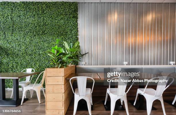 eco friendly interior of cafe. - inside coffe store stock-fotos und bilder
