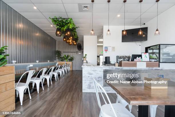 front on view of eco friendly eatery. - empty restaurant stock pictures, royalty-free photos & images
