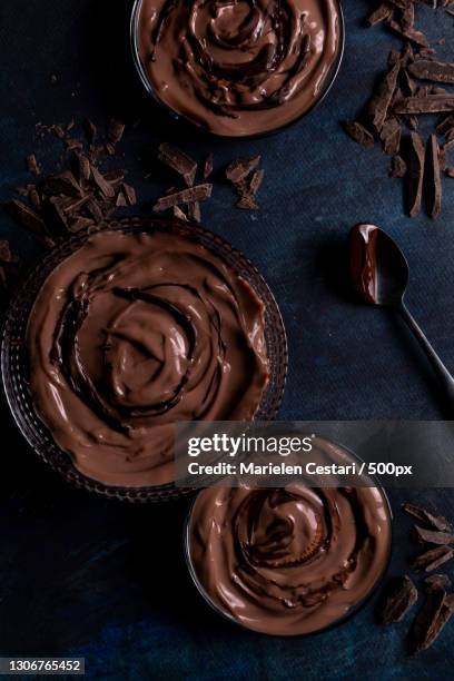 high angle view of chocolate cake on table - mousse stock-fotos und bilder