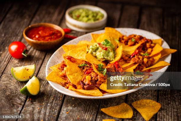 close-up of food in plate on table - tortilla chip stock-fotos und bilder