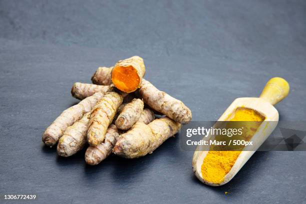 high angle view of turmeric on table - kurkuma stock pictures, royalty-free photos & images