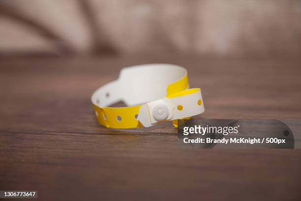 close-up of tape measure on table - namensband stock-fotos und bilder