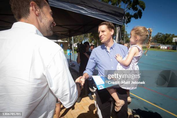 Federal Minister Andrew Hastie is seen greeting WA Liberal Candidate Zak Kirkup at Glencoe Primary School on March 13, 2021 in Halls Head, Australia....