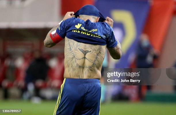 Memphis Depay of Lyon - showing his tattoo of a lion on his back - is frustrated during the Ligue 1 match between Stade de Reims and Olympique...