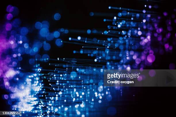 abstract fiber optics blue violet bokeh background - differential focus stock pictures, royalty-free photos & images