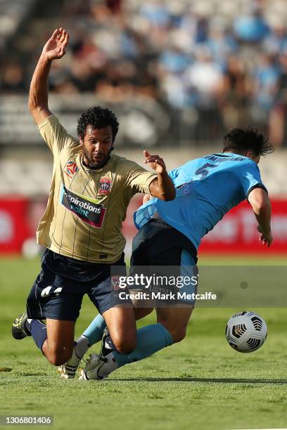 Alexander Baumjohann of Sydney FC and Nikolai Topor-Stanley of the Jets compete for the ball during the A-League match between Sydney FC and the...