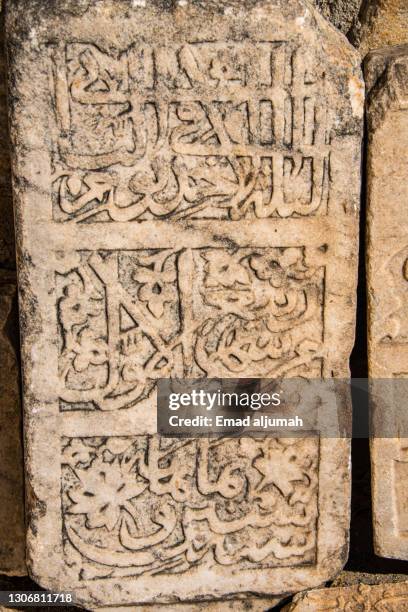 ottoman tombstone with arabic calligraphy script, i̇sabey mosque, selçuk, i̇zmir, turkey - arabic calligraphy stock pictures, royalty-free photos & images