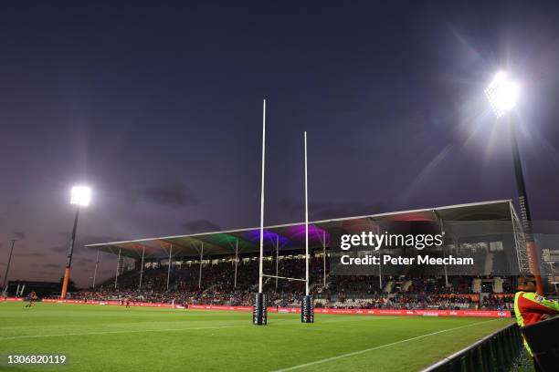 The goalposts and stands are lit up in rainbow colours to celebrate Pride Week during the round three Super Rugby Aotearoa match between the...