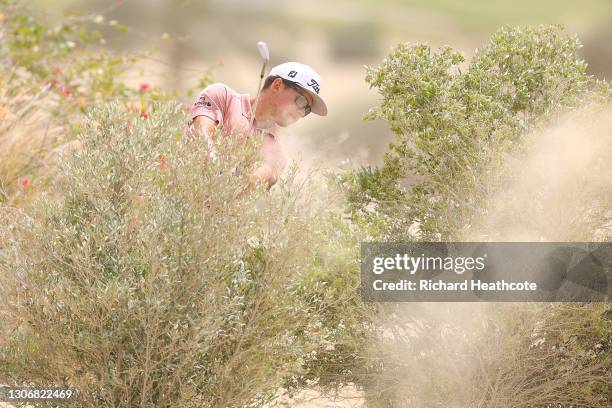 Garrick Higgo of South Africa plays from a waste area on the 3rd during the third round of the Commercial Bank Qatar Masters at Education City Golf...