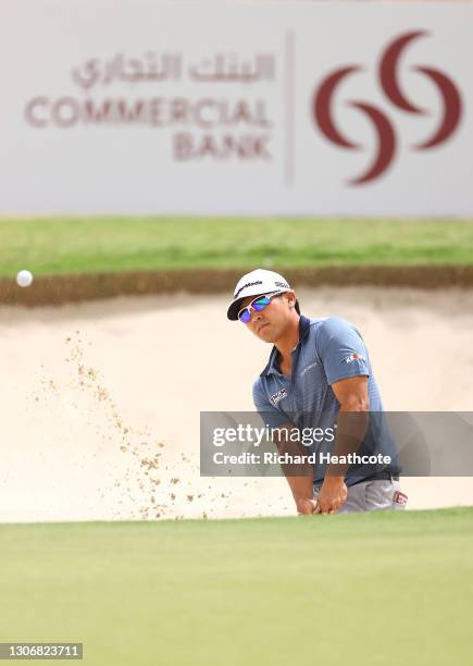 Kurt Kitayama of United States plays from a greenside bunker on the 3rd during the third round of the Commercial Bank Qatar Masters at Education City...