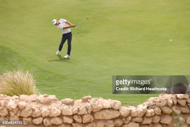 Guido Migliozzi of Italy plays into the 3rd green from near the 4th green after taking a penalty drop during the third round of the Commercial Bank...