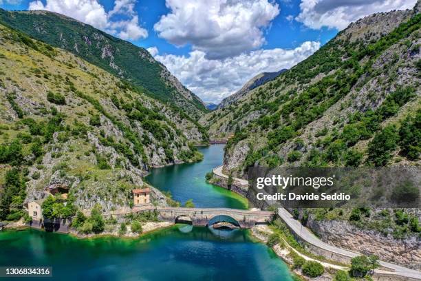 aerial view of the san domenico lake with the footbridge leading to the san domenico hermitage - abruzzi fotografías e imágenes de stock