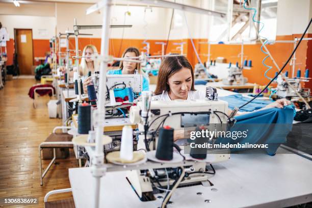 textile industry workers - garment factory stock pictures, royalty-free photos & images