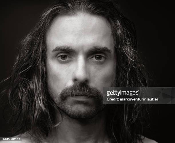 disheveled portait of man with long hair - white jesus stock pictures, royalty-free photos & images