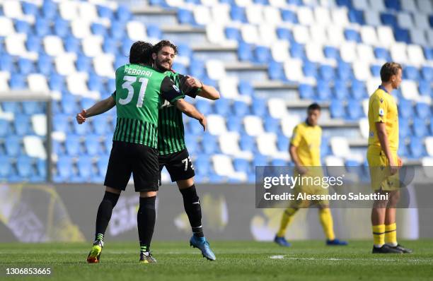 Manuel Locatelli of U.S. Sassuolo Calcio celebrates with teammate Gian Marco Ferrari after scoring his team's first goal during the Serie A match...