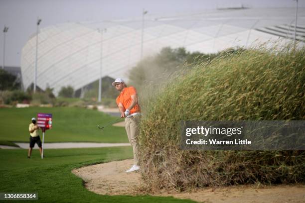 Kalle Samooja of Finland plays his second shot on the 18th hole during the third round of the Commercial Bank Qatar Masters at Education City Golf...